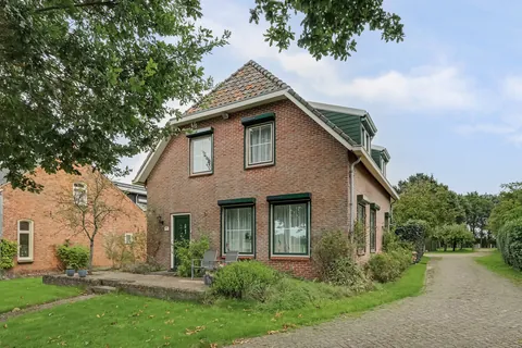 Voorzijde van de vrijstaande woonboerderij aan de Paul Krügerstraat 20 in Nisse